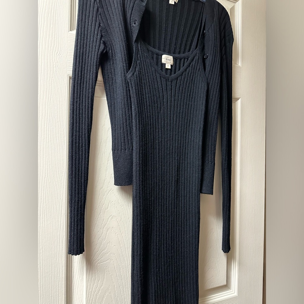 Black sweater dress, never worn. Size small. Very stretchy.